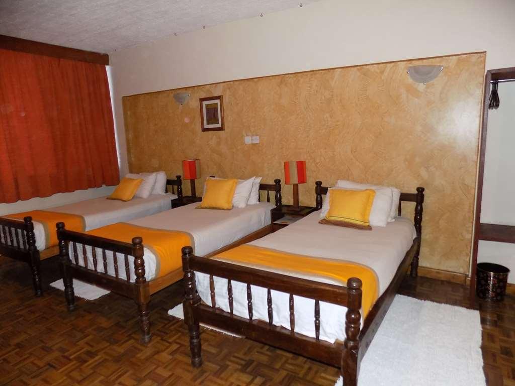 Kenya Comfort Suites Nairobi Quarto foto